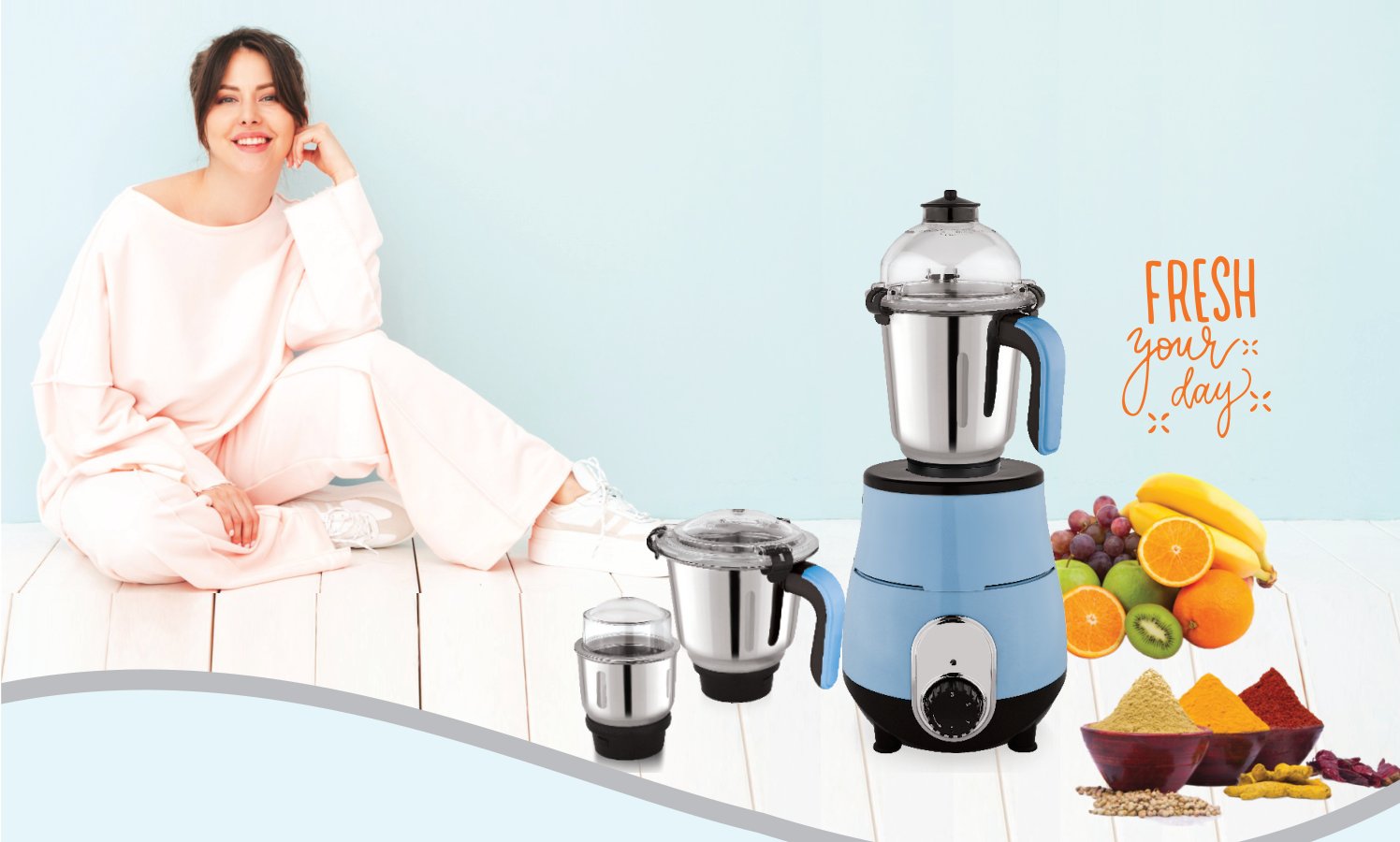STI mixer grinder with jars, fruit and spices in a bright kitchen
